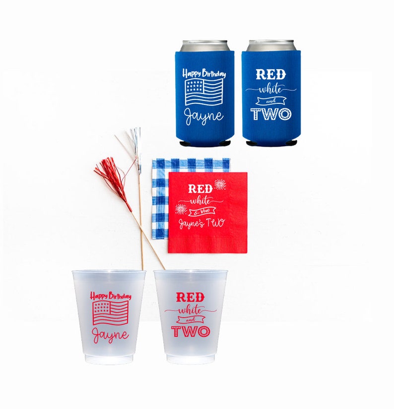 May include: Red, white, and blue party supplies with a red and white checkered napkin, two blue can coolers with the text "Happy Birthday Jayne" and "Red white and TWO", and two clear plastic cups with the same text.
