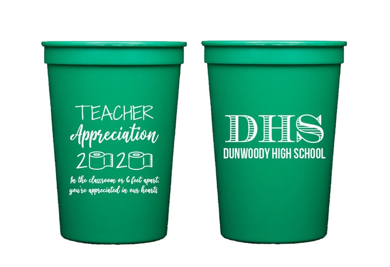 May include: Two green plastic cups with white text. One cup says "Teacher Appreciation 2020" with a toilet paper roll graphic. The other cup says "DHS Dunwoody High School".