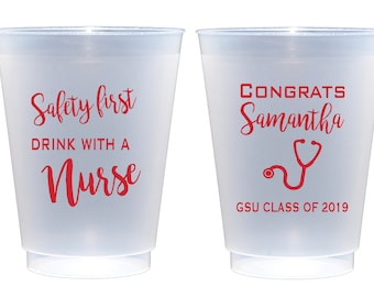 May include: Two frosted plastic cups with red text. One cup reads "Safety first DRINK WITH A Nurse." The other cup says "CONGRATS Samantha" with a stethoscope graphic and "GSU CLASS OF 2019."