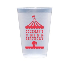 May include: A white plastic cup with a red circus tent design and the text "Coleman's Third Birthday".