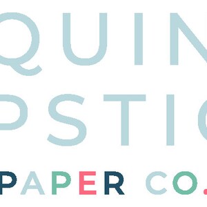 May include: A logo for a company called "Sequins & Lipstick Paper Co.". The logo is in a light blue color with a pink ampersand and a multi-colored word "PAPER" in the bottom.