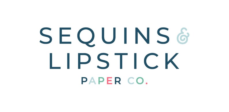 May include: A logo for a company called "Sequins & Lipstick Paper Co.". The logo is in a dark blue color with a light blue ampersand symbol and the words "Paper Co." in a light blue, pink, and green color.
