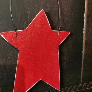 Wood star ornaments. Great for pencil tree summer decoration. Measure about 6 1/2 inches by 5 inches.
