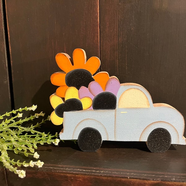 Vintage red truck with flowers in the back