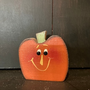 Little pumpkin. Can be personalized with a name, free of charge. Measures 2/12 inches by 2/12 inches.