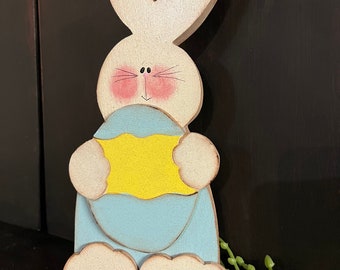 Easter decoration. Boy bunny holding egg. Can be personalized with a name.