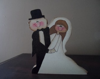 Cute wedding couple. Can be personalized. Would be cute for cake topper or as a gift.