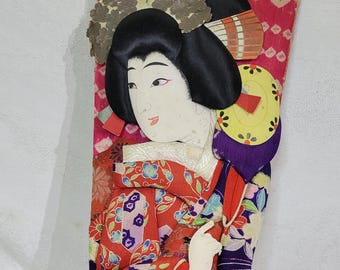 Vintage Japanese kabuki Hagoita Asian doll on a wooden paddle