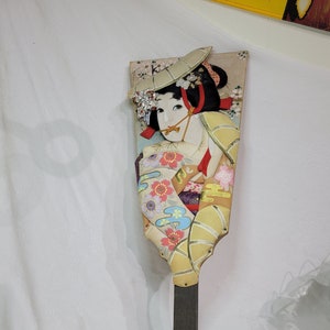 Vintage Japanese kabuki Hagoita Asian doll on a hanging wooden paddle