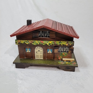 Vintage Swiss Cottage music box, playing Send in the Clowns