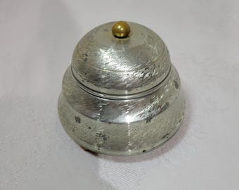 Vintage aluminum powder container music box