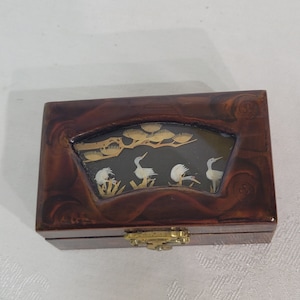 Vintage Asian locking maroon lacquer jewelry box with cork art in the lid and a red lined cushioned drawer