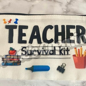 May include: White canvas zippered pouch with the text "TEACHER Survival Kit" printed in black. The pouch features a red apple, a stack of books, a blue marker, a paperclip, and a red cup with yellow pencils.