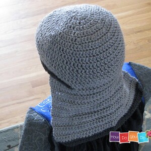 May include: Gray crocheted hat with a wide brim. The hat is made with a simple stitch pattern and has a slouchy fit.