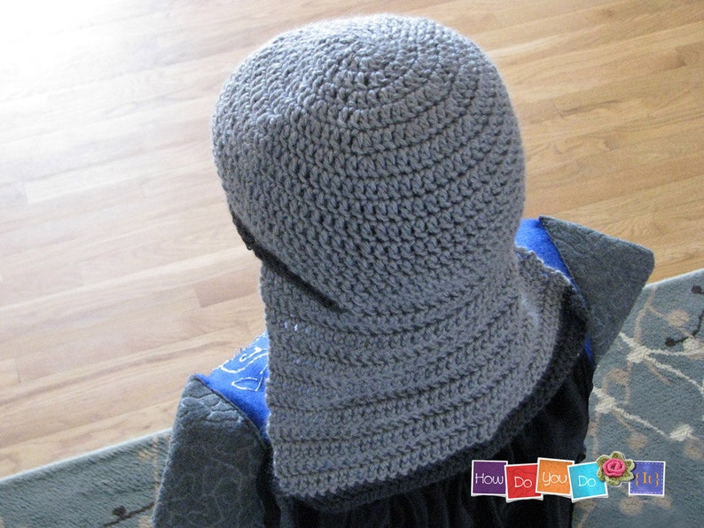 May include: Gray crocheted hat with a wide brim. The hat is made with a simple stitch pattern and has a slouchy fit.