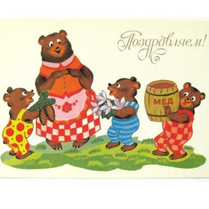 May include: Vintage postcard featuring a family of cartoon bears. The mother bear wears an orange dress and a red and white checkered apron. The bear cubs are dressed in overalls and carry flowers, a pine branch, and a barrel of honey. The text "Congratulations!" is written in cursive.