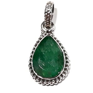 May include: A silver pendant with a teardrop-shaped green gemstone set in a beaded border.