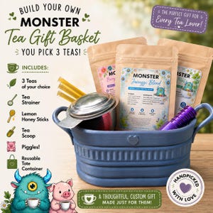May include: A blue metal basket containing three brown paper pouches of Monster tea, a silver metal tea strainer, and yellow honey sticks. The text reads Build Your Own Monster Tea Gift Basket, Monster Jacuzzi Blend, and Handpicked With Love.