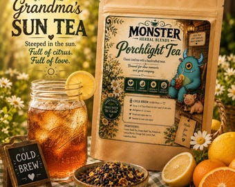 May include: A brown paper pouch of Monster Herbal Blends Porchlight Tea featuring a blue monster illustration, next to a mason jar of iced tea with a lemon slice, a small bowl of loose tea leaves, and a chalkboard sign labeled COLD BREW.