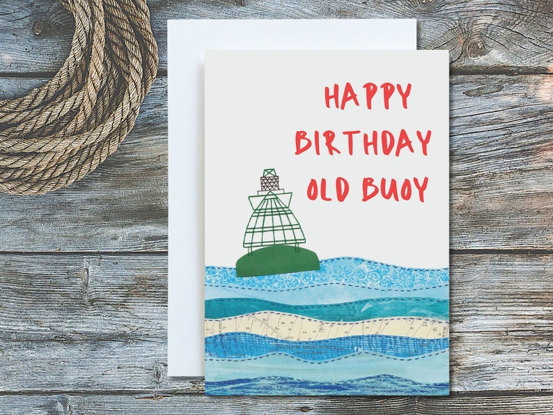 May include: A greeting card featuring a green buoy on a blue and white patterned ocean. The card reads "Happy Birthday Old Buoy".