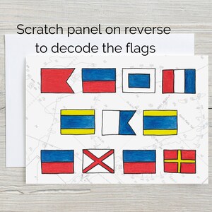 May include: A card with a white background and nine colourful flags. The flags are red, white, blue, and yellow. The card has the text "Scratch panel on reverse to decode the flags".