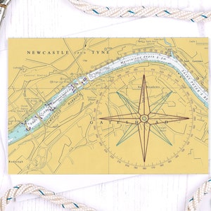 May include: A vintage nautical chart of the Newcastle upon Tyne harbour area with a compass rose and the text "Maintained depth 5-2m".
