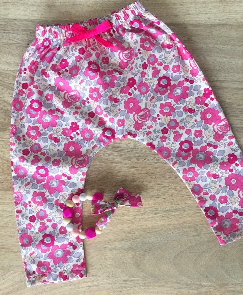 Neon pink bow and Liberty Betsy bougainvillea baby harem pants
