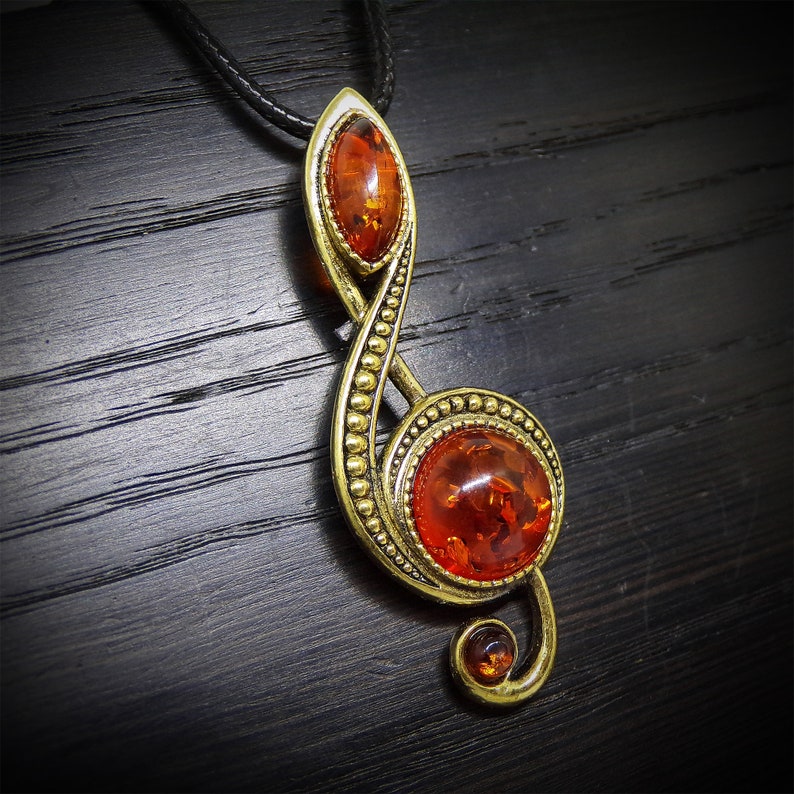 Treble clef pendant with Baltic Amber