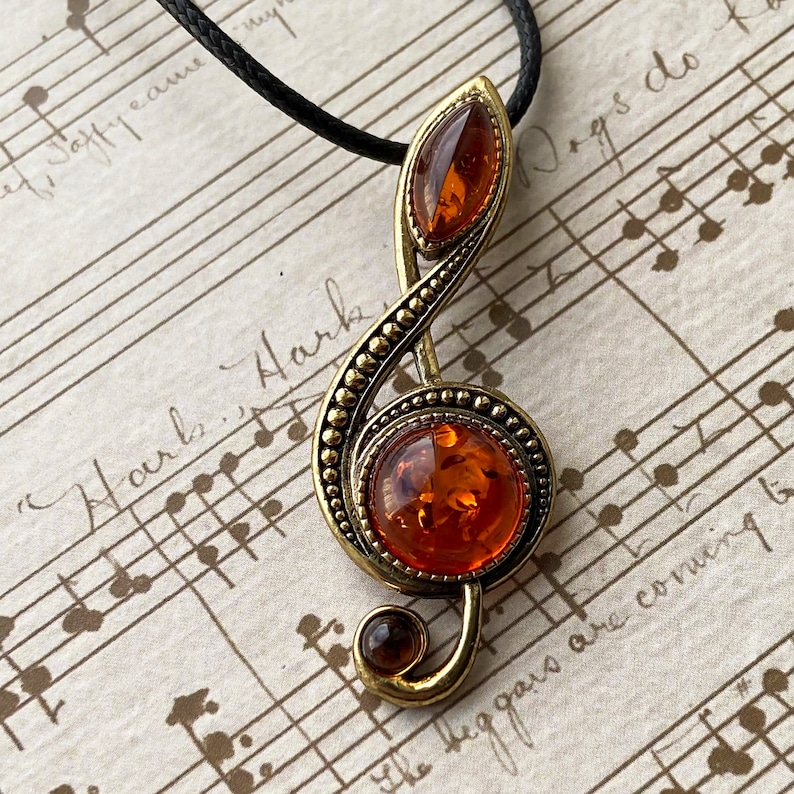 Treble clef pendant with Baltic Amber