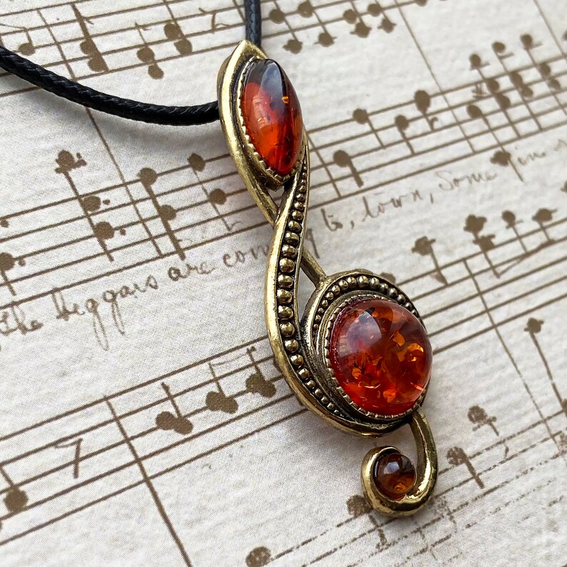 Treble clef pendant with Baltic Amber