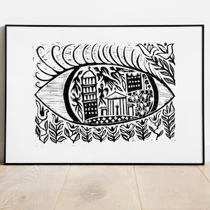 May include: Black and white linocut print of an eye with a cityscape inside. The eye is surrounded by stylized floral designs.