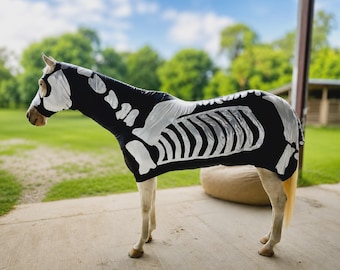 May include: A black horse bodysuit featuring a white skeletal print that covers the neck, torso, and hindquarters. The garment includes a full hood that covers the head and neck, displaying a detailed rib cage and bone structure design.
