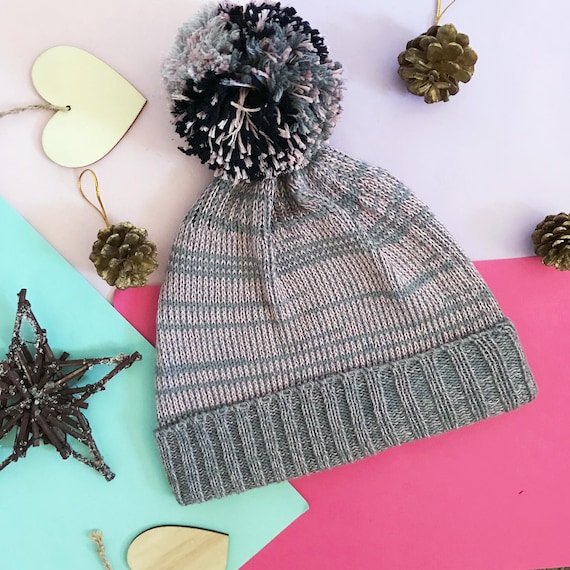 grey and pink bobble hat