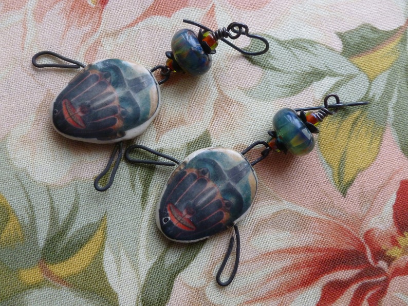 silverfishdesigns Pacific Northwest Indigenous Art Jewelry Haida Mask Ceramic Decal Earrings CeramicFantasyByLina Northernblooms