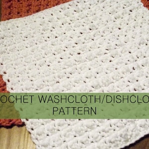 May include: A white square crochet washcloth or dishcloth with a textured bobble stitch pattern, layered over a similar orange crochet cloth. The image includes the text CROCHET WASHCLOTH/DISHCLOTH PATTERN overlaid in a green banner.