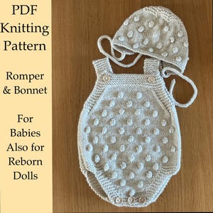 May include: A light gray knitted romper and bonnet set with a textured dot pattern. The romper has button closures and adjustable straps. The bonnet has ties. The text on the left says "PDF Knitting Pattern Romper & Bonnet For Babies Also for Reborn Dolls."
