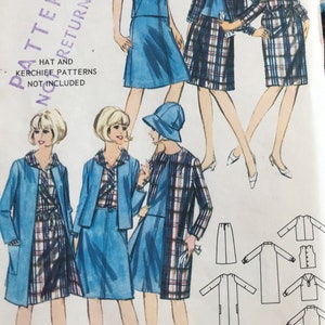 May include: Vintage sewing pattern for a reversible dress and jacket. The pattern includes a blue denim dress and a plaid jacket. The pattern is for sizes 10-18. The text on the pattern reads "Madras and Denim Coordinates... REVERSIBLE PATTERNS RETURNABLE HAT AND KERCHIEF PATTERNS NOT INCLUDED"