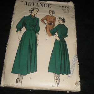 May include: Vintage sewing pattern for a dress, Advance pattern number 4979, size 12, bust 30, hip 33. The pattern shows two women wearing green dresses with a button-up front and a gathered skirt.