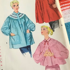 May include: A vintage sewing pattern featuring three different styles of blouses with embroidered collars. The blouses are in blue, red, and pink.