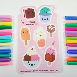 May include: A pink sticker sheet featuring various ice cream designs with smiling faces and the text "YOU'VE BEEN SERVED." The sheet is surrounded by colorful markers in shades of pink, green, blue, and yellow.