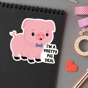 May include: A pink pig wearing a blue bow tie with the text "I'm a pretty pig deal" on a black background.