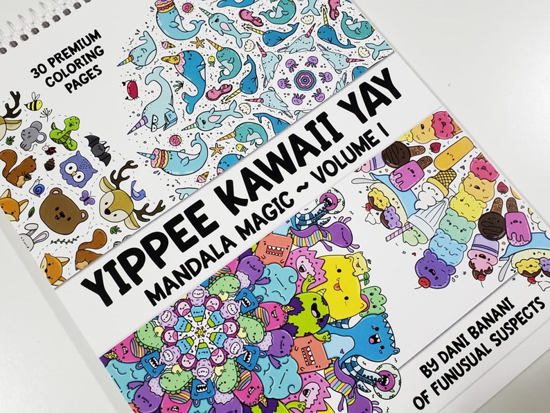 May include: A colorful coloring book with the title "Yippee Kawaii Yay Mandala Magic ~ Volume I" and the text "30 Premium Coloring Pages" on the cover. The book features a variety of cute and whimsical illustrations, including animals, food, and flowers.