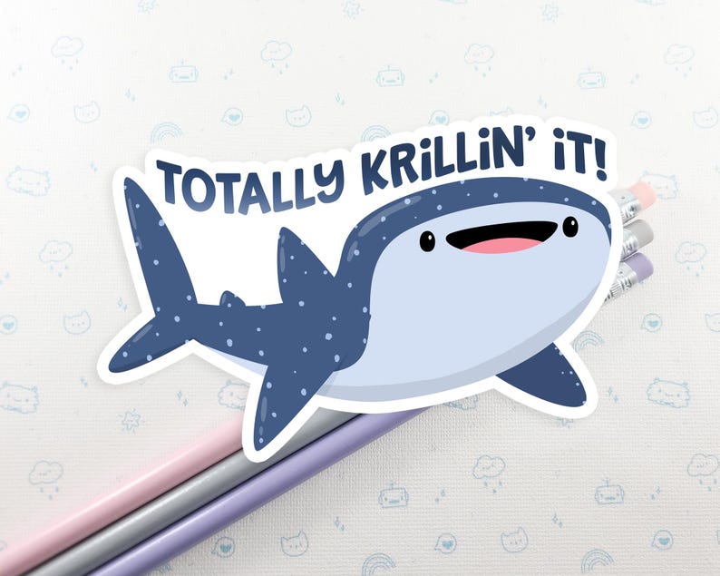 May include: A blue and white whale shark sticker with the text "Totally Krillin' It!" on a white background.
