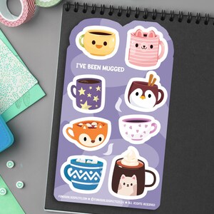 May include: A set of 8 colorful mug stickers with different animal designs. The stickers feature a fox, penguin, cat, and more. The text "I've Been Mugged" is printed on the sticker sheet.