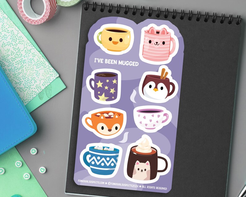 May include: A set of 8 colorful mug stickers with different animal designs. The stickers feature a fox, penguin, cat, and more. The text "I've Been Mugged" is printed on the sticker sheet.