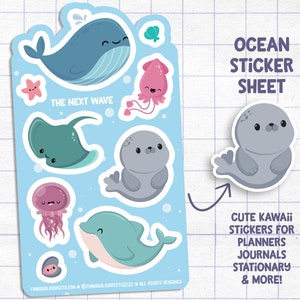 May include: A sticker sheet with a blue background featuring cute cartoon ocean animals. The sheet includes a whale, a stingray, a seal, a jellyfish, a dolphin, and a clam. The text "The Next Wave" is printed on the sheet. The text "Ocean Sticker Sheet" is printed at the top of the sheet. The text "Cute Kawaii Stickers for Planners Journals Stationary & More!" is printed at the bottom of the sheet.