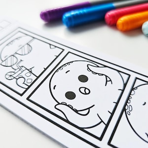 May include: A black and white coloring book page featuring cartoon octopuses in a comic strip format. The octopus characters are in various poses. Colored markers in purple, blue, red, orange, and pink are in the background.