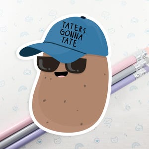 May include: A brown potato wearing a blue baseball cap with the text "Taters Gonna Tate" and sunglasses.