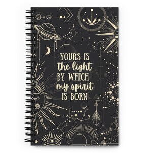 May include: Black spiral bound notebook with a celestial design and the quote "Yours is the light by which my spirit is born".