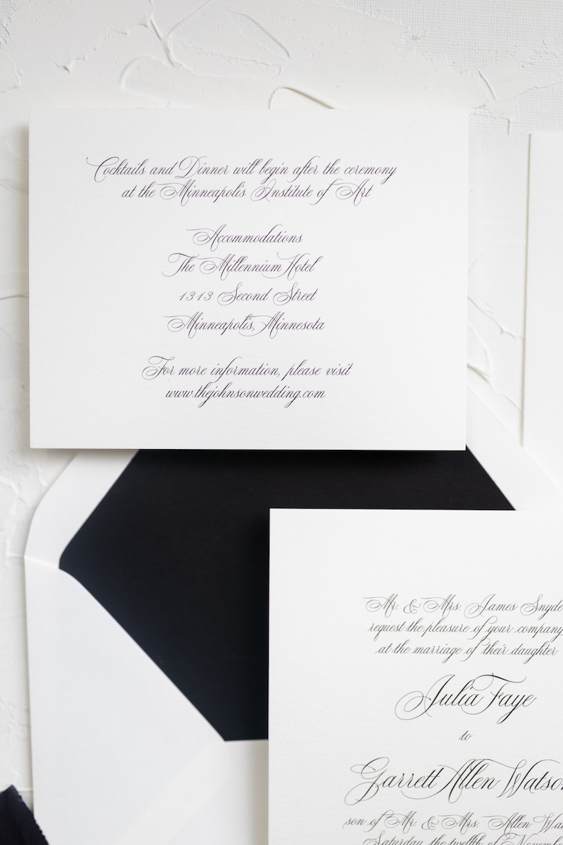 May include: A white wedding invitation with black calligraphy text. The invitation reads "Mr. & Mrs. James Snyde request the pleasure of your company at the marriage of their daughter Julia Faye to Garrett Allen Watson son of Mr. & Mrs. Allen Watson Saturday the twelfth of November"